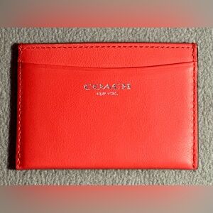 Coach y2k slim card case in dark coral.